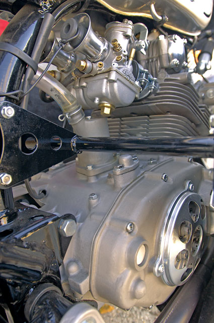 The lovely little 125cc double-overhead cam twin is mostly hidden by the large fairing on Ron Mousouris and Guy Webster’s CR93.